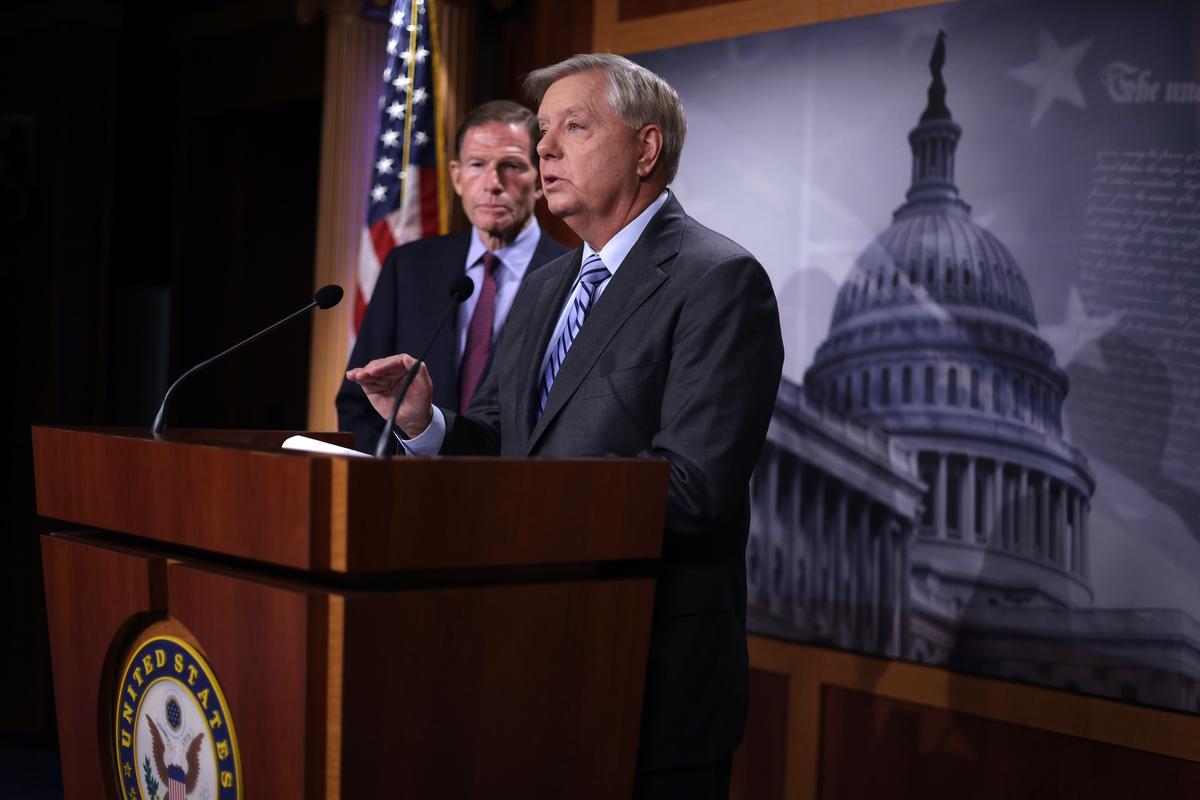 Sen. Lindsey Graham (R-S.C.) speaks as Sen. Richard Blumenthal (D-Conn.) listens during a news conference at the U.S. Capitol in Washington, on Sept. 29, 2022. (Alex Wong/Getty Images)
