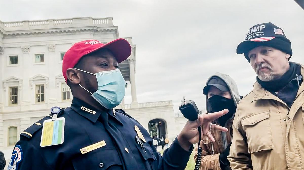 Lt. Tarik Johnson talks to a group of Oath Keepers about a group of officers trapped in the U.S. Capitol in Washington on Jan. 6, 2021. (Rico La Starza, Archive.org/Screenshot via The Epoch Times)