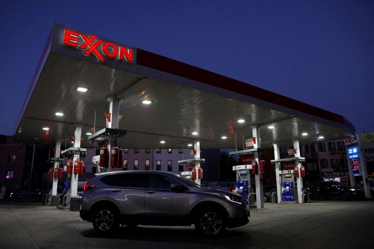 Cars are seen at an Exxon gas station in Brooklyn, New York, on Nov. 23, 2021. (Andrew Kelly/Reuters)
