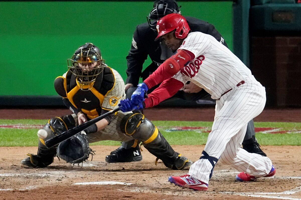 Philadelphia Phillies' Jean Segura hits a two-run single during the fourth inning in Game 3 of the baseball NL Championship Series between the San Diego Padres and the Philadelphia Phillies in Philadelphia on Oct. 21, 2022. (Matt Rourke/AP Photo)