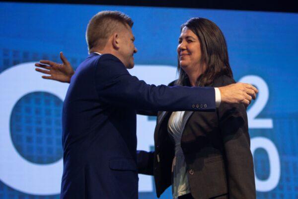 Alberta Premier Danielle Smith hugs Brian Jean at the United Conservative Party AGM at the River Cree Resort near Edmonton on Oct. 22, 2022. (The Canadian Press/Amber Bracken)