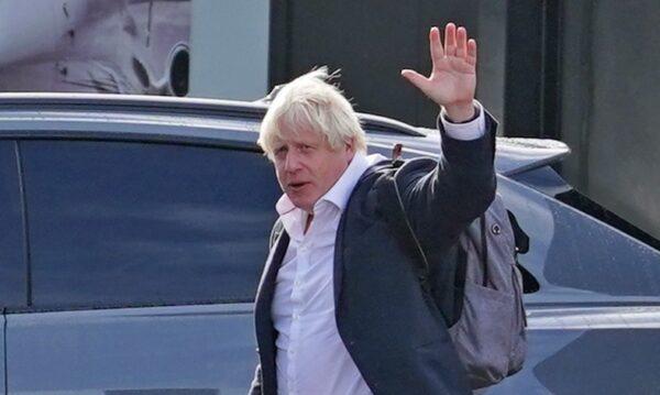 Former Prime Minister Boris Johnson arriving at Gatwick Airport, in London, on Oct. 22, 2022. (Gareth Fuller/PA Media)