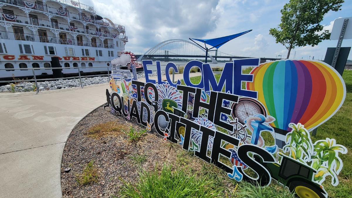 A colorful sign welcomes visitors to the Quad Cities of Rock Island and Moline, Ill., and Davenport and Bettendorf, Iowa. (Courtesy of Jim Farber)