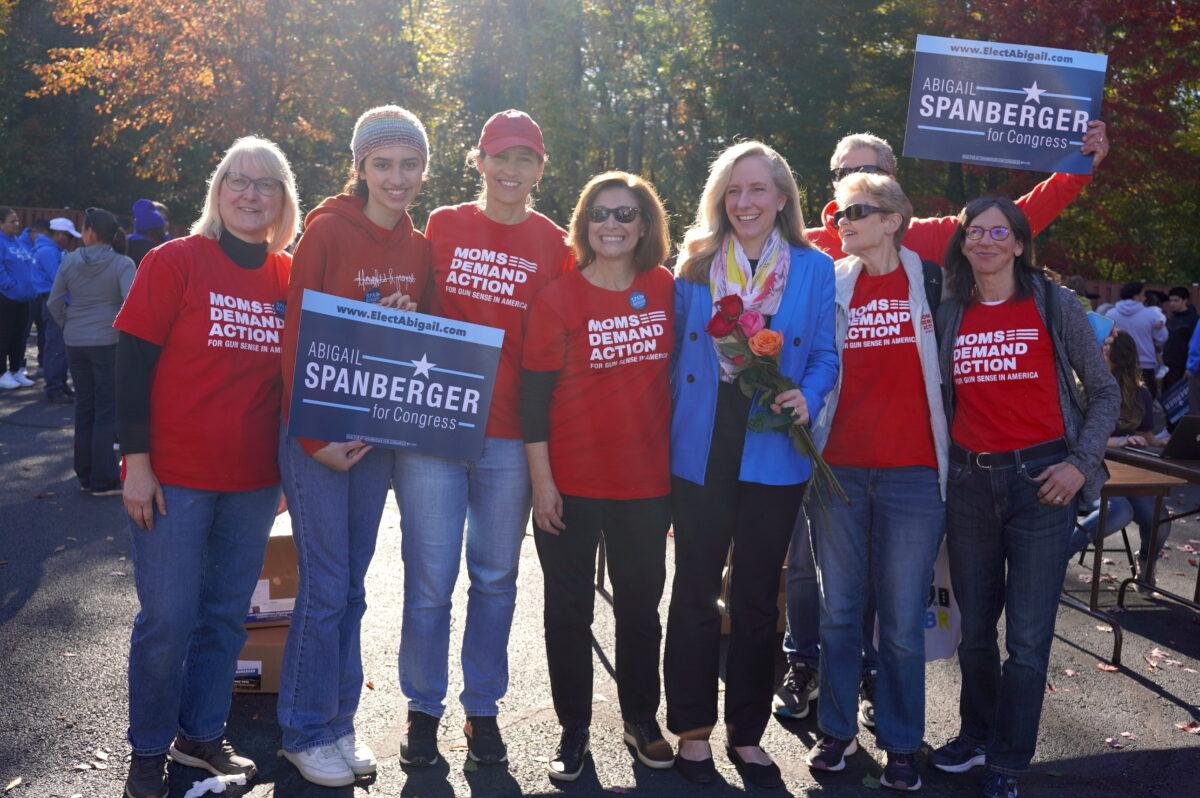 Rep. Abigail Spanberger (D-Va.) (3rd R) with supporters from Moms Demand Action, a grassroots gun control advocacy group, in Woodbridge, Va., on Oct. 22, 2022. (Terri Wu/The Epoch Times)