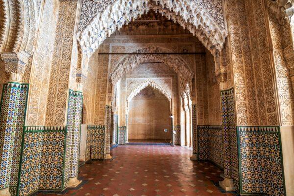 Across the Courtyard of Lions is the Hall of the Kings, a space divided into a series of arches and alcoves leading up to a vaulted ceiling. It has beautiful geometric patterns and stucco walls, characteristic of Moorish architecture. Once again, the simplicity of the exterior contrasts with the richly decorated interior. (<a href="https://www.shutterstock.com/g/sopotnicki">Sopotnicki</a>/<a href="https://www.shutterstock.com/image-photo/arabic-interior-hall-kings-alhambra-palace-2064009113">Shutterstock</a>)