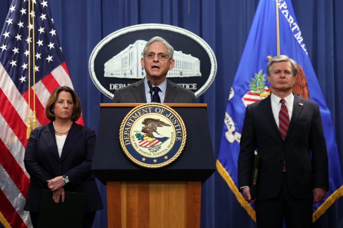 Attorney General Merrick Garland (C), FBI Director Christopher Wray (R), and Deputy Attorney General Lisa Monaco hold a press conference at the U.S. Department of Justice in Washington on Oct. 24, 2022. (Kevin Dietsch/Getty Images)