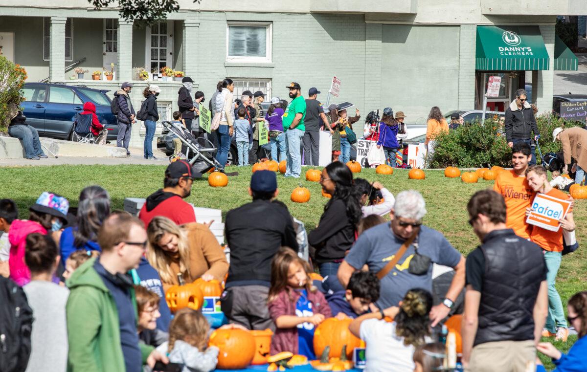 Protestors gather on the sidewalk as San Francisco residents carve pumpkins with California Sen. Scott Wiener and drag queen judges in San Francisco on Oct. 22, 2022. (John Fredricks/The Epoch Times)