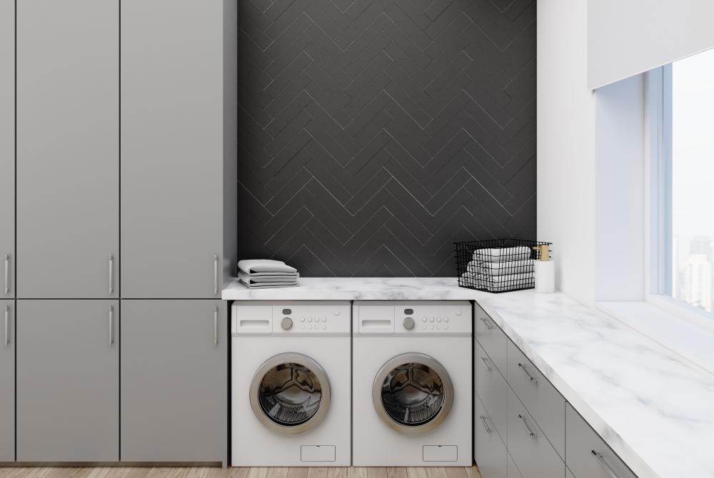If you have matching front-load machines, top them with a washer/dryer countertop for more folding space.(ImageFlow/Shutterstock)