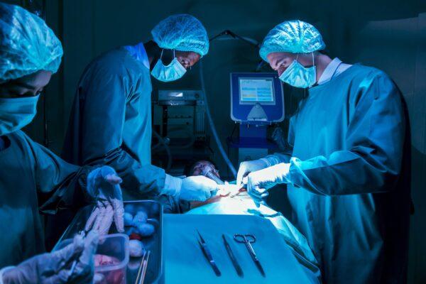 A team of surgeon doctors performs heart surgery on a patient. (File Photo)
