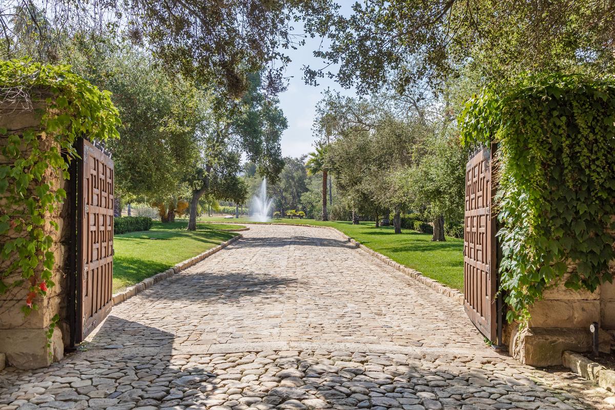 Set behind private gates off a meandering country lane, this exclusive property delivers a luxurious lifestyle. (Courtesy of Simon Berlyn for Sotheby’s International Realty)