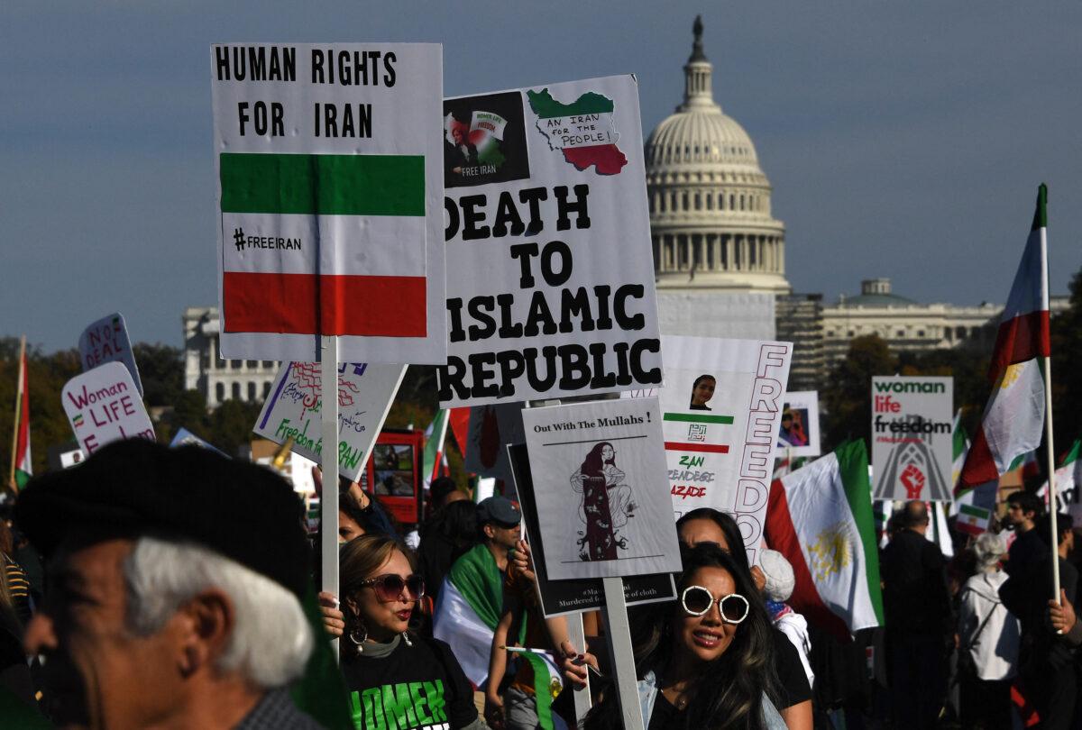 Protesters march in solidarity with protesters in Iran on the National Mall in Washington, on Oct. 22, 2022. (Olivier Douliery /AFP via Getty Images)