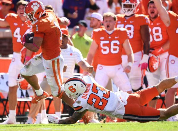 Will Shipley (1) of the Clemson Tigers evades a tackle attempt by Justin Barron (23) of the Syracuse Orange before scoring a fourth quarter touchdown at Memorial Stadium, in Clemson, S.C. on Oct. 22, 2022. (Eakin Howard/Getty Images)