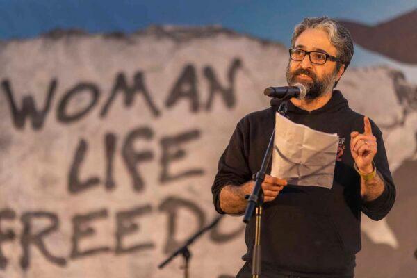 Iranian Canadian author and activist Hamed Esmaeilion speaks at a rally organized by the "Women Life Freedom Collective" in solidarity with women and protesters in Iran on Oct. 22, 2022, in Berlin. (Maja Hitij/Getty Images)