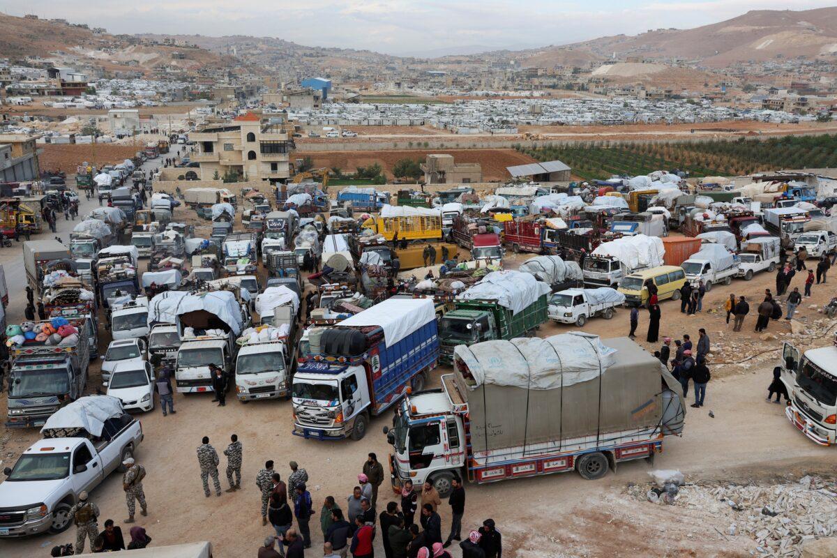 Syrian refugees prepare to return to Syria from Wadi Hmayyed, on the outskirts of the Lebanese border town of Arsal, Lebanon, on Oct. 26, 2022. (Mohamed Azakir/Reuters)