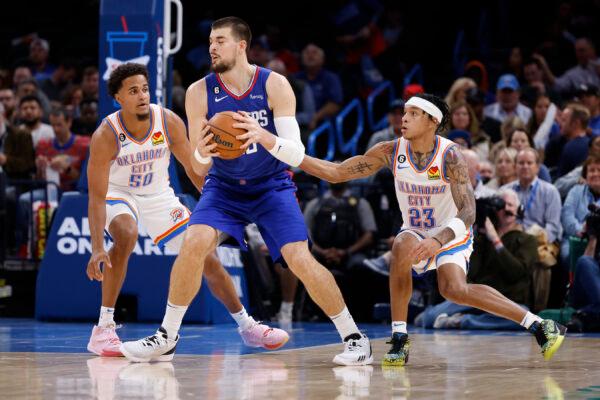 Los Angeles Clippers center Ivica Zubac (40) goes against Oklahoma City Thunder forward Jeremiah Robinson-Earl (50) and guard Tre Mann (23) during the first half of an NBA basketball game in Oklahoma City, on Oct. 25, 2022. (Garett Fisbeck/AP Photo)