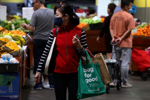 People shop for fruit and vegetable produce at Paddy's Market in Sydney, Australia, on Oct. 22, 2022. (Lisa Maree Williams/Getty Images)