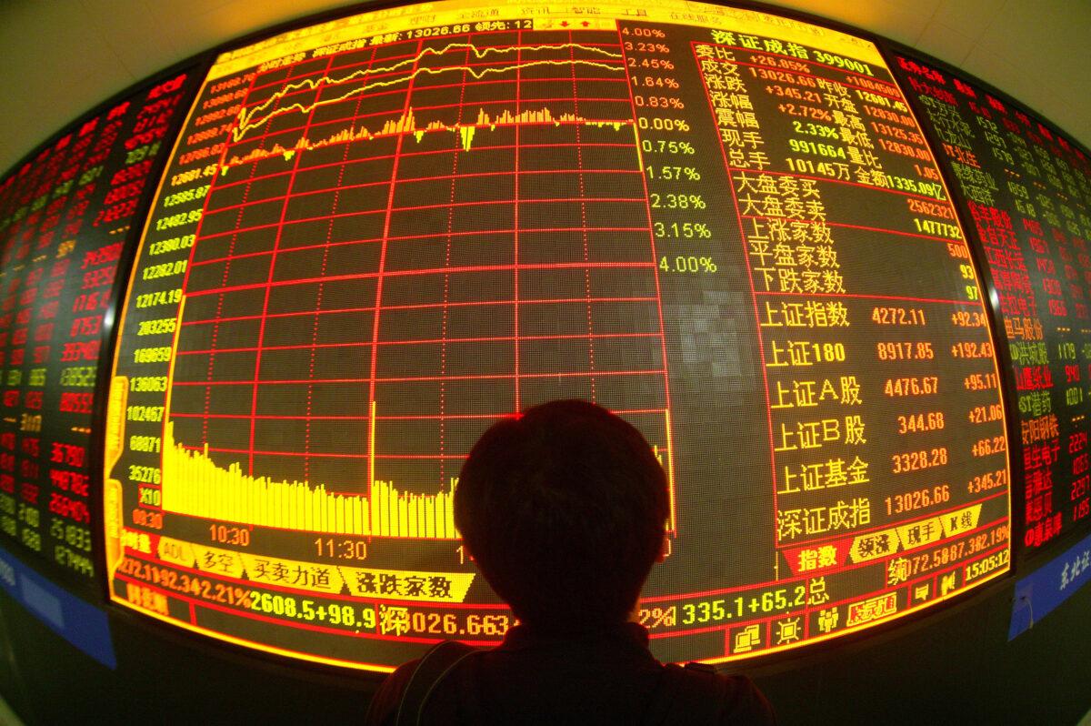 An investor views stock prices on monitors at a securities company in Changchun of Jilin Province, China, on May 28, 2007. (China Photos/Getty Images)