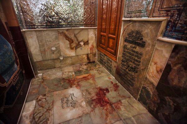 Bullet holes on the wall and blood on the ground after gunmen attacked the Shah Cheragh shrine in the southern city of Shiraz, Iran, on Oct. 26, 2022. (Mohammadreza Dehdari/Iranian Students' News Agency, ISNA via AP)