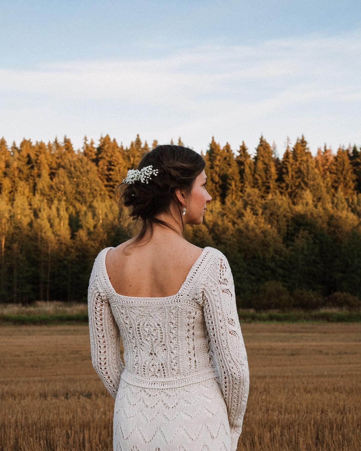 Veronika Lindberg wearing her knitted wedding dress, displaying its square-shaped neckline. (Courtesy of Jukka Heino)