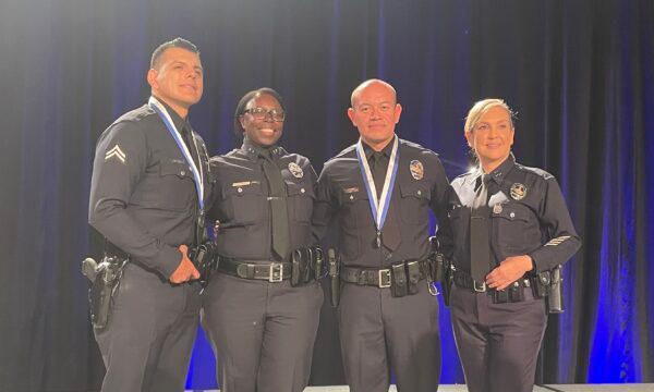 Los Angeles Police Department officer Nicole Minarik (R) is among the 14 officers honored for their acts of heroism and sacrifice at the Westin Bonaventure Hotel in downtown Los Angeles on Oct. 20, 2022. (Carol Cassis/The Epoch Times)