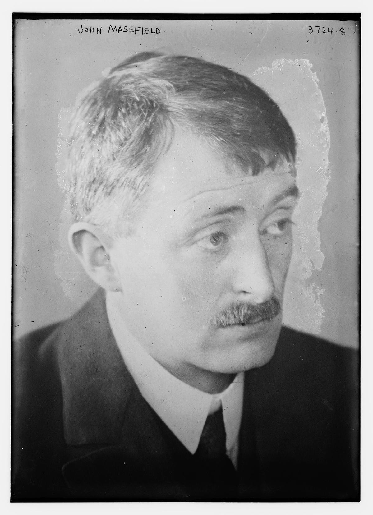 Although he wrote novels, essays, and histories, John Masefield won his highest accolades for his poetry. Glass negative of Masefield photographed between circa 1910 and 1920. (Public Domain)