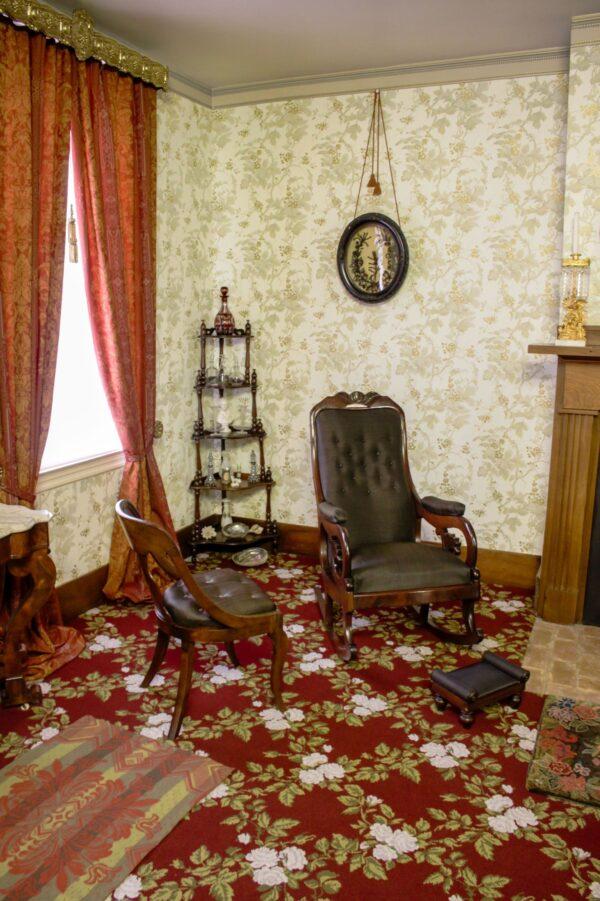 This corner of the front parlor is arranged today exactly as it was when the Lincolns lived in the home. The side chair and mahogany rocking chair sport the same woven horsehair found on all the Lincolns' upholstered pieces, while the corner étagère (a ladder-type bookshelf) features antique “whatnots,” or what we refer to today as knickknacks. Hanging on the wall is a shadow box featuring an artistic arrangement of real hair, another 19th-century commonality. (Courtesy of the National Park Service)
