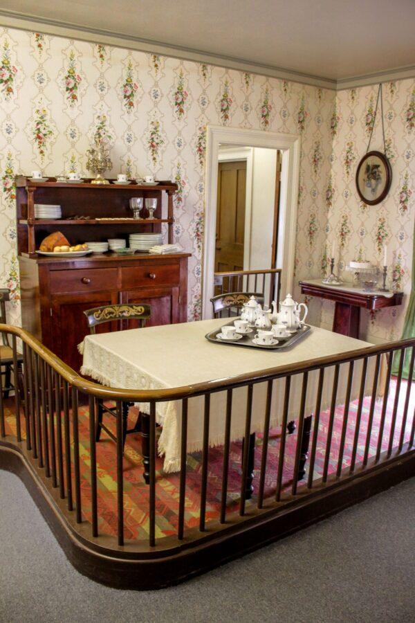 Originally part of the kitchen, the dining room was separated to be a more formal room when the second full floor was added to the home in 1856. The Hitchcock-style painted mahogany chairs were used by the Lincolns, as was the dining table. Mary’s transfer-print ironstone dinnerware was not salvaged, but National Park Service curators found antique dinnerware similar to that which was used regularly by the Lincolns. (Courtesy of the National Park Service)