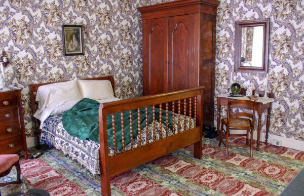 Mary’s bedroom was where she not only rested but also sewed. Since closets were typically not part of a 19th-century home’s design, armoires housed clothing, and hers was most likely a stately solid wood piece such as the one currently on display in her bedroom. She also had a rocking chair and dressing table. The current wallpaper in her bedroom is a copy of the original that once graced the house. (Courtesy of the National Park Service)