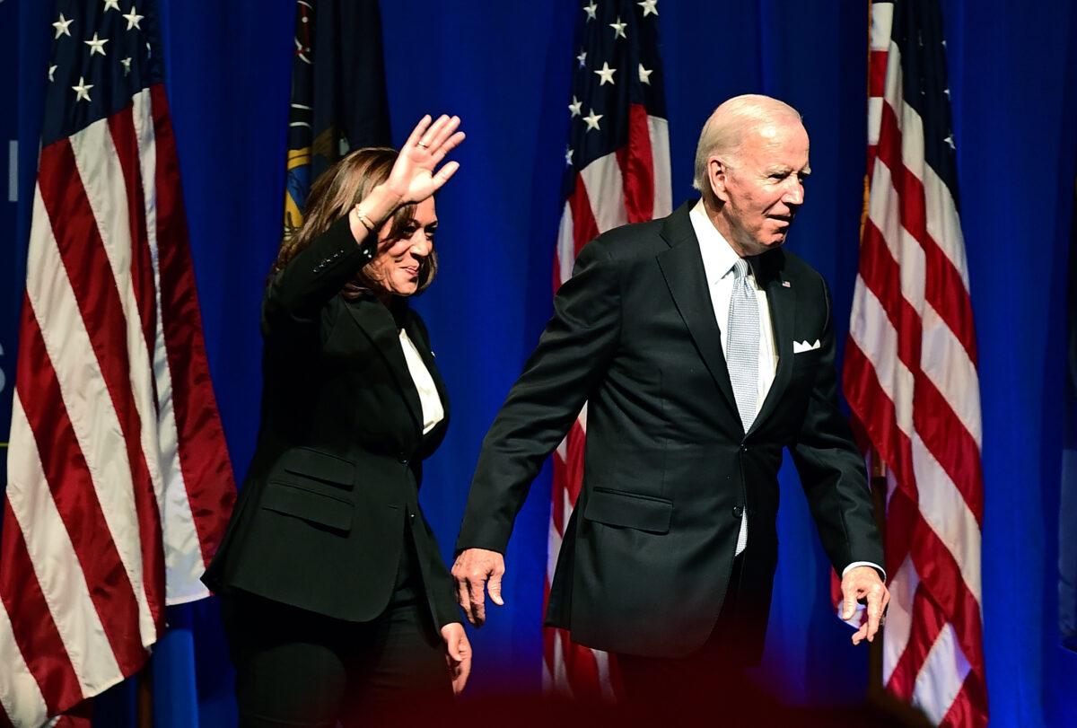President Joe Biden and Vice President Kamala Harris wave to supporters during the Democratic Party's Independence Dinner in Philadelphia on Oct. 28, 2022. (Mark Makela/Getty Images)