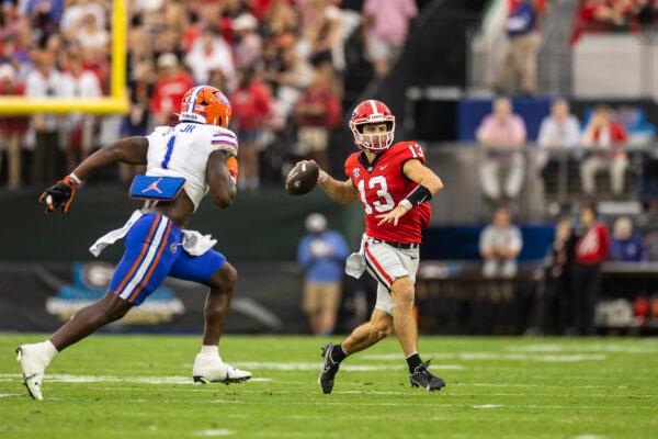 Stetson Bennett (13) of the Georgia Bulldogs looks to pass during the first half of a game against Brenton Cox Jr. (1) of the Florida Gators at TIAA Bank Field in Jacksonville, Flor., on Oct. 29, 2022. (James Gilbert/Getty Images)