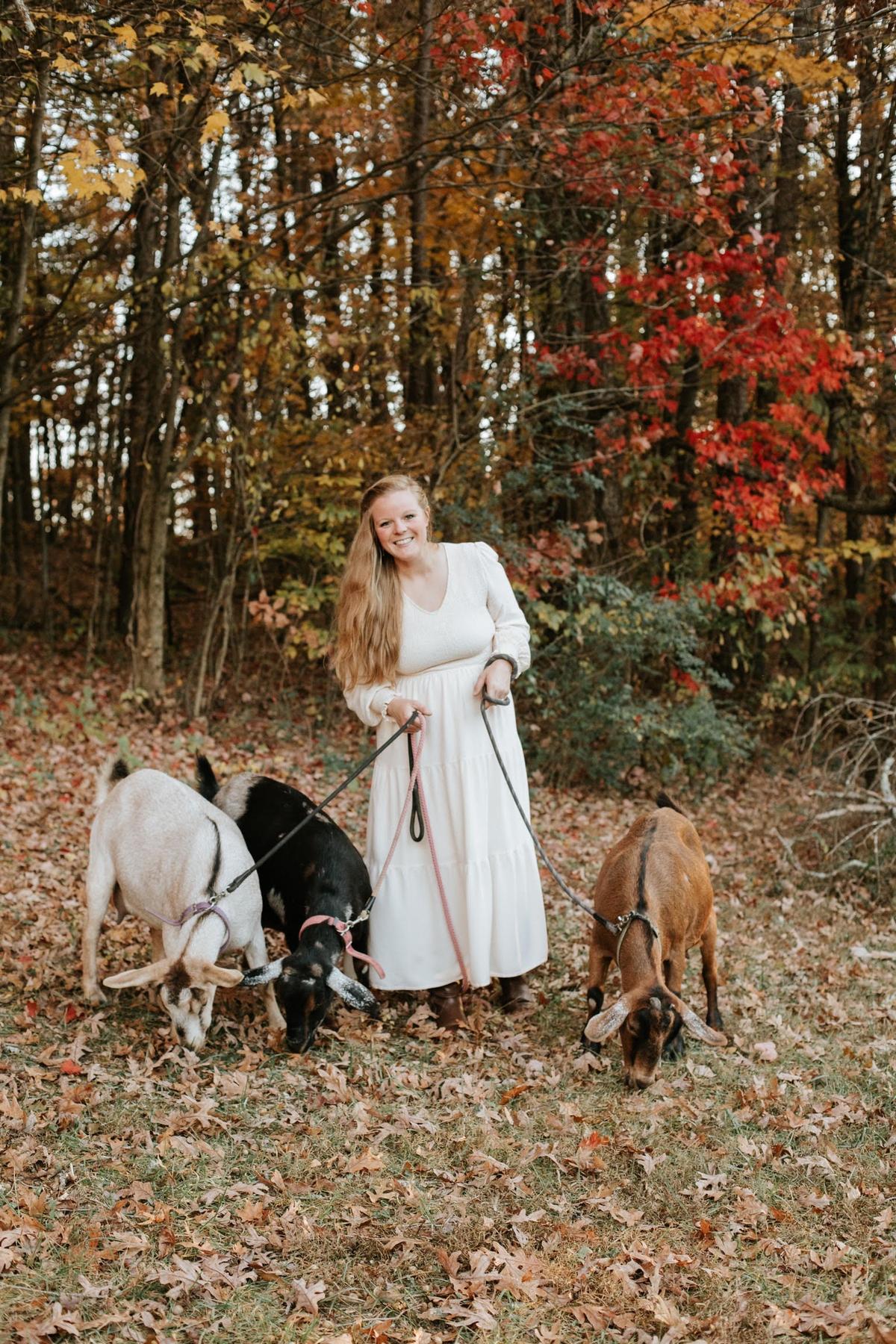 Cortney with her goats. (Courtesy of The Tiffaney Lawson Company)