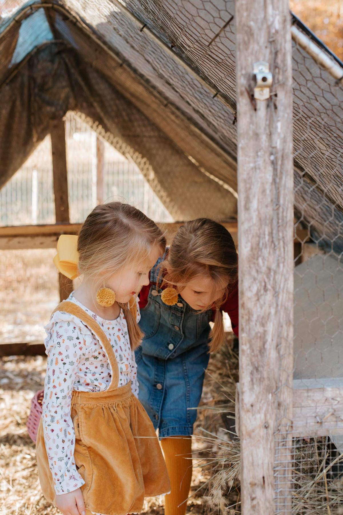 Cortney and Samuel's daughters helping out on the farm. (Courtesy of The Tiffaney Lawson Company)