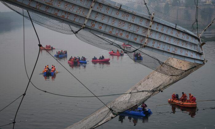 9 Arrested After Bridge Collapses in India, Killing 134