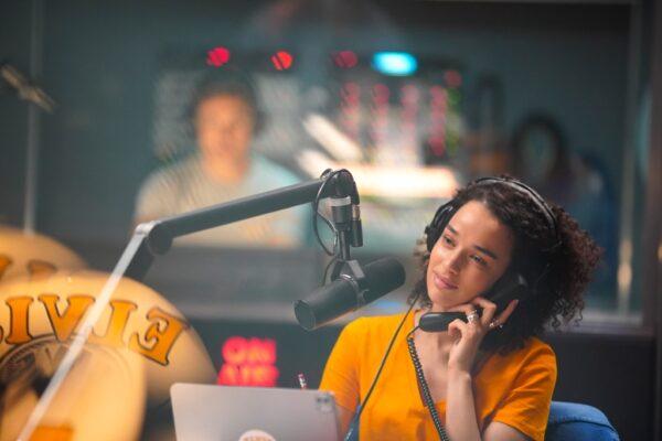 The radio show is produced by Mary (Alia Seror-O’Neill), in "On the Line." (Saban Films)