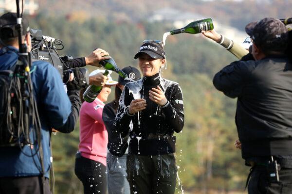 Lydia Ko of New Zealand is poured champagne after winning the tournament on the 18th green during the final round of the BMW Ladies Championship at Oak Valley Country Club in Wonju, South Korea, on Oct. 23, 2022. (Chung Sung-Jun/Getty Images)