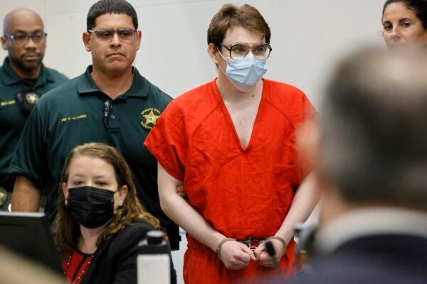 Marjory Stoneman Douglas High School shooter Nikolas Cruz is escorted into the courtroom for a hearing regarding possible jury misconduct during deliberations in the penalty phase of his trial at the Broward County Courthouse in Fort Lauderdale, Fla., on Oct. 14, 2022. (Amy Beth Bennett/South Florida Sun Sentinel via AP, Pool)