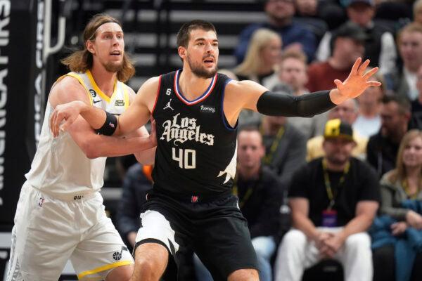 Utah Jazz forward Kelly Olynyk, left, guards Los Angeles Clippers center Ivica Zubac (40) during the first half of an NBA basketball game in Salt Lake City, on Nov. 30, 2022. (Rick Bowmer/AP Photo)