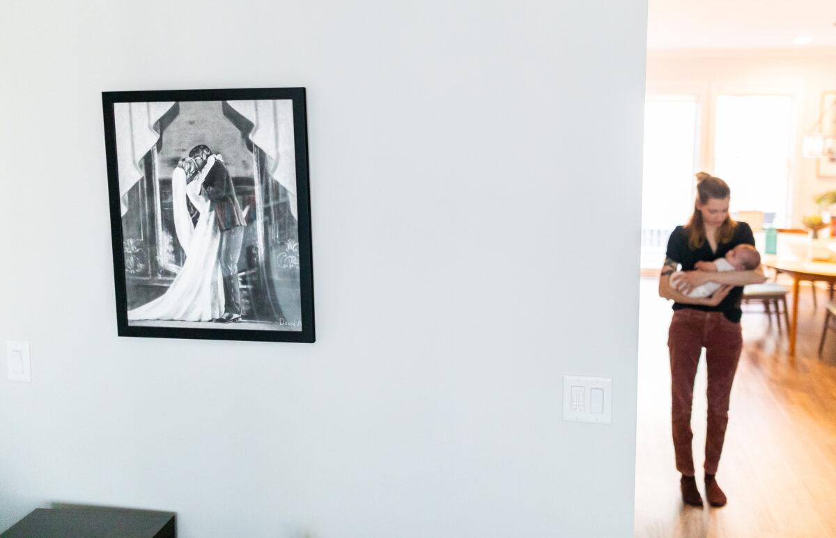 A wedding picture is displayed on the wall of the Strongin home in northeastern Illinois on Nov. 1, 2022. (John Fredricks/The Epoch Times)