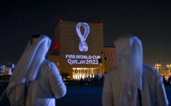Qataris gather at the capital Doha's traditional Souq Waqif market as the official logo of the FIFA World Cup Qatar 2022 is projected on the front of a building on Sept. 3, 2019. (AFP via Getty Images)
