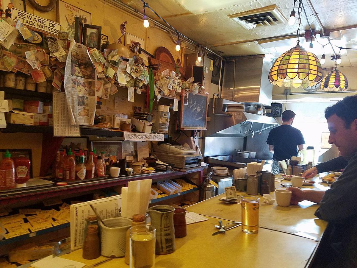 The 14-seat counter, with Will Harris cooking at the grill in the background, at Al’s Breakfast. (Courtesy of Al's Breakfast)