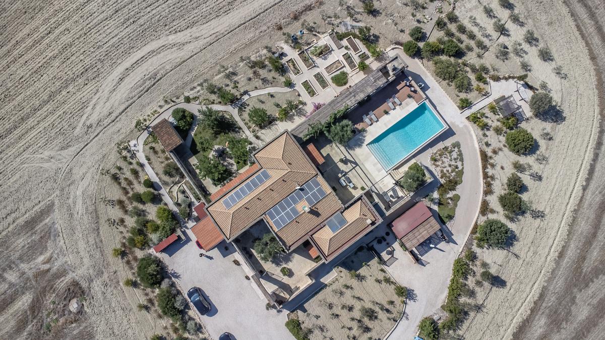 An aerial view reveals the estate’s very private location, surrounded by olive and citrus groves. (Courtesy of Sotheby’s Concierge Auctions)