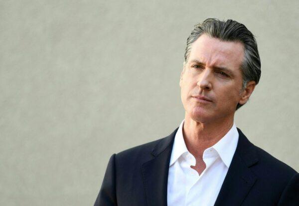California Gov. Gavin Newsom listens to a question during a press conference in Los Angeles on Nov. 10, 2021. (Patrick T. Fallon/AFP via Getty Images)