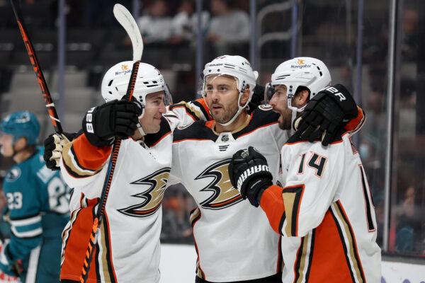 Adam Henrique (14) of the Anaheim Ducks is congratulated Frank Vatrano (77) and Kevin Shattenkirk (22) of the Anaheim Ducks after he scored a goal against the San Jose Sharks by in the first period at SAP Center in San Jose, Calif., on Nov. 1, 2022. (Ezra Shaw/Getty Images)