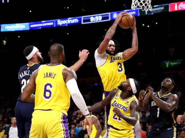Anthony Davis (3) of the Los Angeles Lakers grabs a rebound above Zion Williamson (1) of the New Orleans Pelicans and Patrick Beverley (21) during a Lakers overtime win at Crypto.com Arena in Los Angeles, on Nov. 2, 2022. (Harry How/Getty Images)