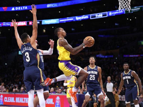 Lonnie Walker IV (4) of the Los Angeles Lakers attempts a layup in front of Zion Williamson (1), Trey Murphy III (25), Jonas Valanciunas (17) and CJ McCollum (3) of the New Orleans Pelicans during a Lakers overtime win at Crypto.com Arena, in Los Angeles, on Nov. 2, 2022. ( Harry How/Getty Images)