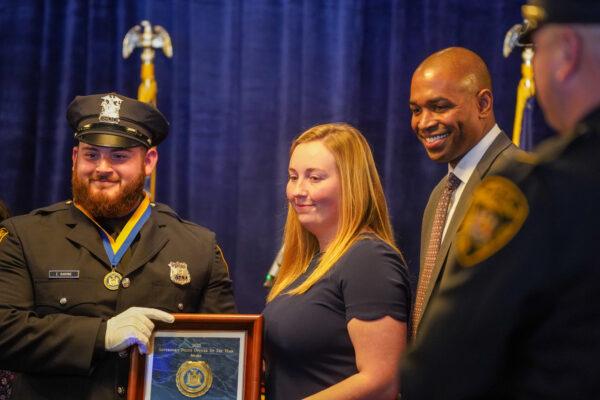 Middletown Police Officer Evan Barone (L) received the award of New York State Police Officer Medal of Valor from Lt. Gov. Antonio Delgado  on Nov. 1, 2022. (Cara Ding/The Epoch Times)
