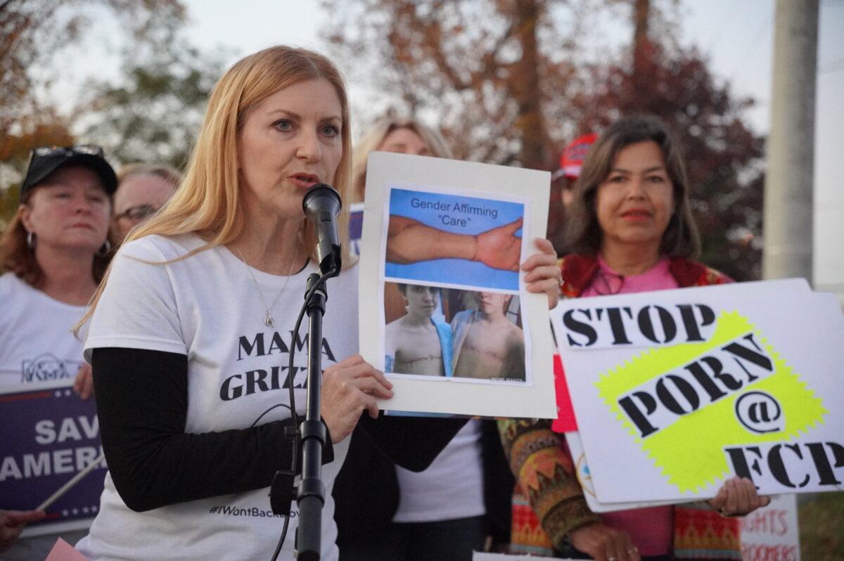 Stacy Langton (2nd L) protests the school district's pro-transgender policies and "gender-affirming care" outside a Fairfax County School Board meeting in Falls Church, Va., on Nov. 3, 2022. (Terri Wu/The Epoch Times)