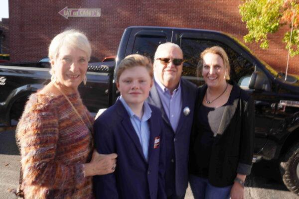 Walter Yarbrough, 12, dressed up like Georgia Gov. Brian Kemp for a Kemp rally November 4, 2022 in Winder, Ga. Walter, 2nd from the left, with his grandmother Gwen Rice, L, his grandfather Mike Rice, 3rd from the left and his aunt Michael (cq) Miller, R. (Photo by Dan M. Berger of The Epoch Times.)