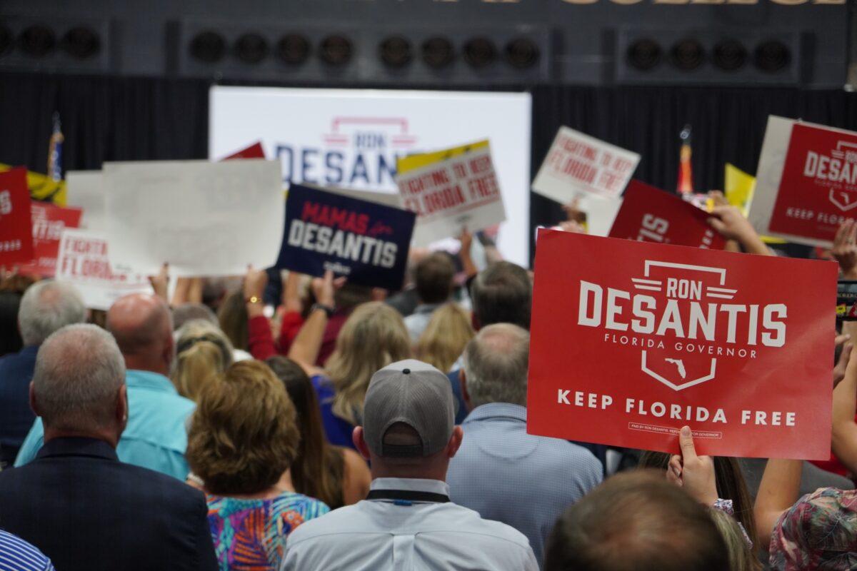 Just before his reelection, Florida Gov. Ron DeSantis takes the stage in a packed college gymnasium in rural Columbia County at a campaign event on Nov. 3, 2022. (The Epoch Times)