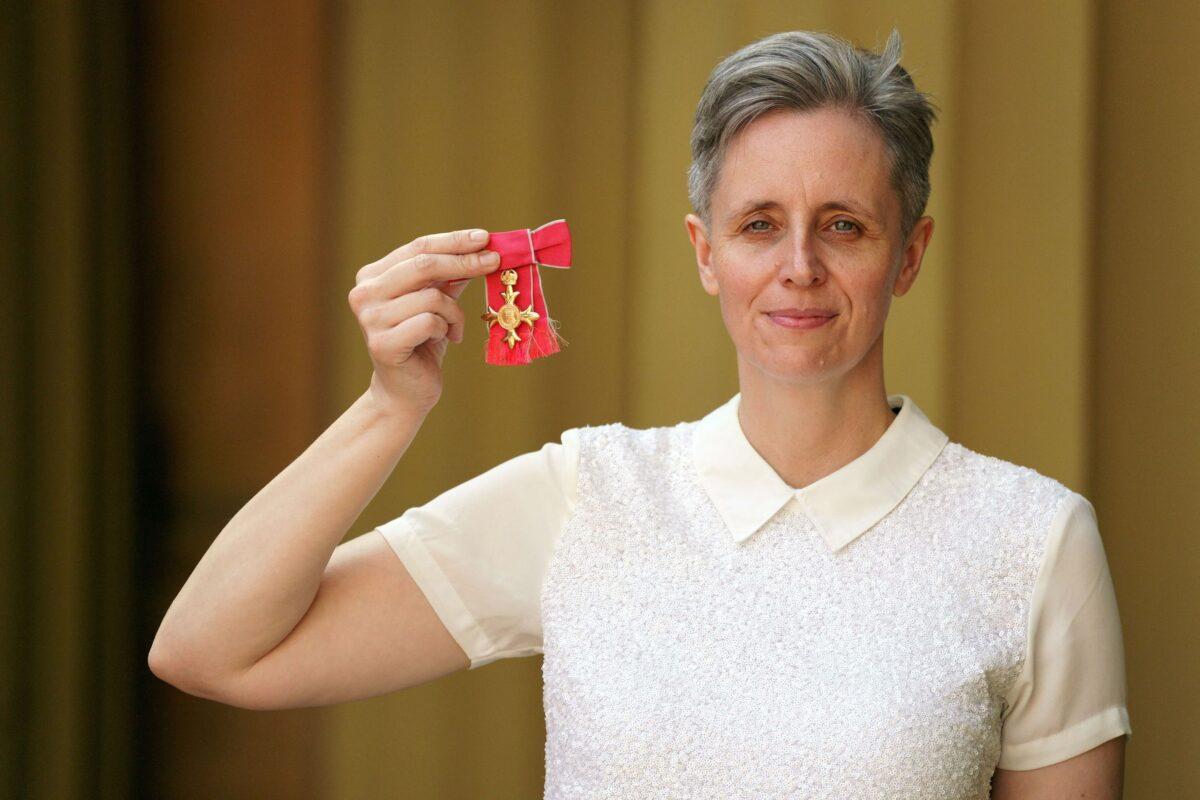Professor of philosophy at the University of Sussex, Kathleen Stock, poses with her medal after being appointed an Officer of the Order of the British Empire (OBE) for services to higher education a investiture ceremony at Buckingham Palace, London, on July 14, 2022. (Victoria Jones/POOL/AFP via Getty Images)